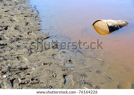 Rusty Barrel Pollutes River