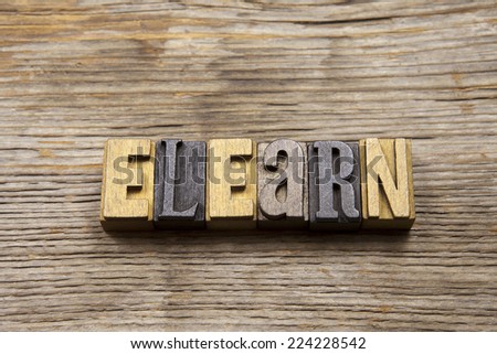 E-Learn in rustic wooden typeset on wooden background