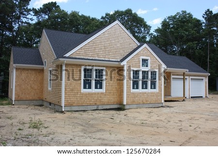 A new house and garage under construction in the suburbs
