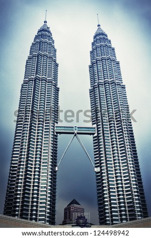 Kuala Lumpur, Malaysia - December 20: Petronas Twin Towers On December 20, 2010 In Kuala Lumpur, Malaysia. Petronas Towers Are Twin Skyscrapers And Were Tallest Buildings In The World Until 2004