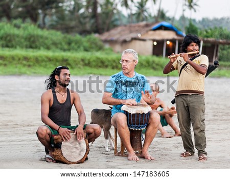 Goa, India - November 08: Hippies Playing Music On Arambol Beach On November, 08, 2011, Goa, India. At The Arambol Beach People Often Sit And Enjoy The Setting Sun, Playing Music, Meditation, Etc.