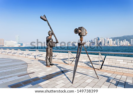 HONG KONG, CHINA - FEBRUARY 21: Statues and skyline on Avenue of Stars on February 21, 2013 in Hong Kong, China. The promenade honours celebrities of the HK film industry as the famous city attraction