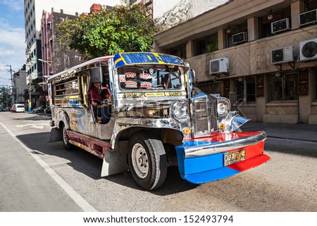 MANILA, PHILIPPINES - FEBRUARY 24: Jeepney on the street on February, 24, 2013, Manila, Philippines. Jeepneys are the most popular means of public transportation in the Philippines.