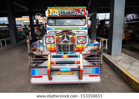 MANILA, PHILIPPINES - FEBRUARY 26: Jeepney on the bus station on February, 26, 2013, Manila, Philippines. Jeepney is a most popular public transport on Philippines.