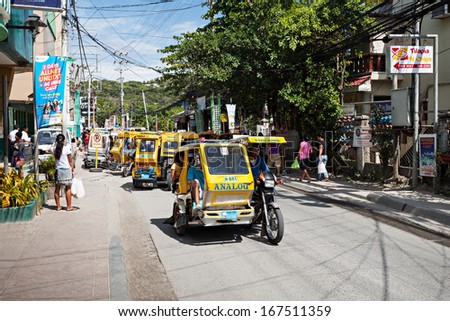 BORACAY, PHILIPPINES - MARCH 04: Tricycle on the street, March 04, 2013, Boracay, Philippines. Motorized tricycles are a common means of passenger transport everywhere in the Philippines.