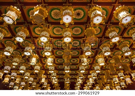 SINGAPORE - OCTOBER 16, 2014: Inside the Buddha Tooth Relic Temple. It is a Buddhist temple located in the Chinatown district of Singapore.