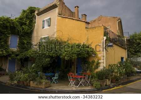 Old cafe and inn on the medieval square of a village in Provence