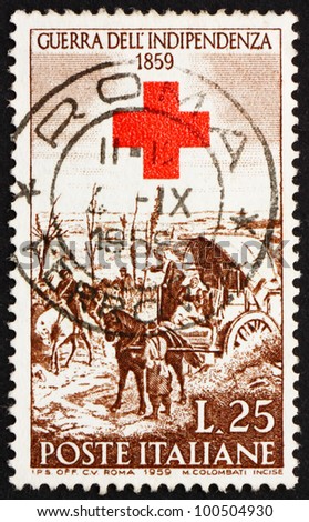 ITALY - CIRCA 1959: a stamp printed in the Italy shows After the Battle of Magenta, painting by Giovanni Fattori and Red Cross, Centenary of the War of Independence, circa 1959