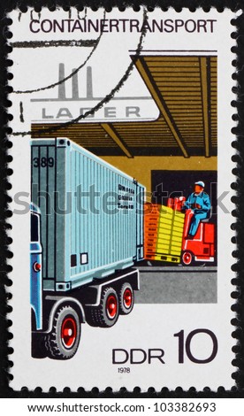 GDR - CIRCA 1978: a stamp printed in GDR shows Loading Container on Truck, circa 1978