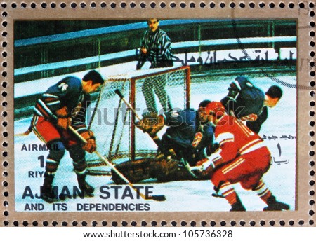 AJMAN - CIRCA 1973: a stamp printed in the Ajman shows Ice Hockey, Winter Olympics, circa 1973