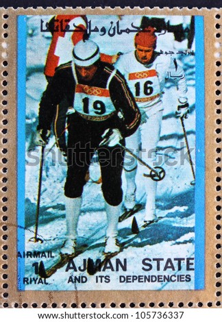 AJMAN - CIRCA 1973: a stamp printed in the Ajman shows Cross-country Skiing, Winter Olympics, circa 1973