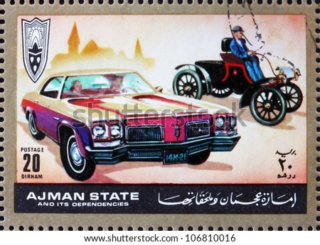 AJMAN - CIRCA 1972: a stamp printed in the Ajman shows Ford, Cars Then and Now, circa 1972