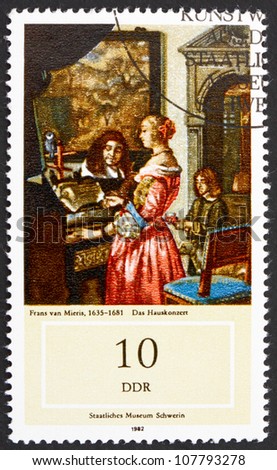 GDR - CIRCA 1982: a stamp printed in GDR shows Music Making at Home, Painting by Frans van Mieris, circa 1982