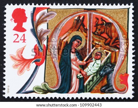 GREAT BRITAIN - CIRCA 1991: a stamp printed in the Great Britain shows Mary placing Jesus in Manger, Illuminated Letters from Venetian Manuscript, Christmas, circa 1991