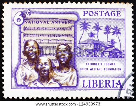 LIBERIA - CIRCA 1957: a stamp printed in the Liberia shows Singing Boys and National Anthem, Founding of the Antoinette Tubman Child Welfare Foundation, circa 1957