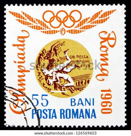 ROMANIA - CIRCA 1964: a stamp printed in the Romania shows Wrestling, Rome 1960, Romanian Olympic Gold Medal, circa 1964