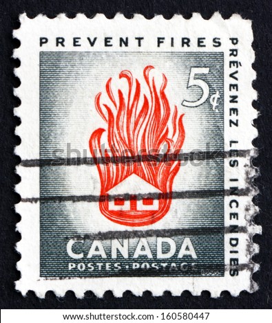 CANADA - CIRCA 1956: a stamp printed in the Canada shows House on Fire, the Needless Waste Caused by Preventable Fires, circa 1956
