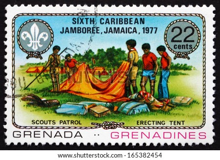 GRENADA - CIRCA 1977: a stamp printed in Grenada shows Erecting Tent, 6th Caribbean Jamboree, Kingston, Jamaica, circa 1977