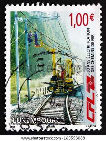 LUXEMBOURG - CIRCA 2006: a stamp printed in the Luxembourg shows Railway Workers Repairing Electrical Wires, Electrification of Railway Network, 50th Anniversary, circa 2006