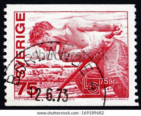 SWEDEN - CIRCA 1973: a stamp printed in the Sweden shows Worker, Confederation Emblem, 75th Anniversary of the Swedish Confederation of Trade Unions, circa 1973
