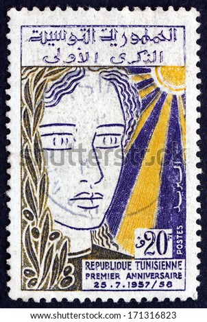 TUNISIA - CIRCA 1958: a stamp printed in Tunisia shows Woman\'s Head, First Anniversary of the Republic, circa 1958