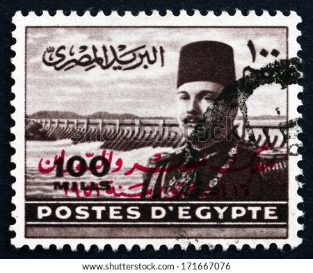 EGYPT - CIRCA 1949: a stamp printed in Egypt shows King Farouk of Egypt and Aswan Dam, circa 1949