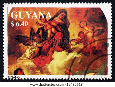 GUYANA - CIRCA 1991: a stamp printed in Guyana shows Madonna and Child with Angels, Painting by Titian, Christmas, circa 1991