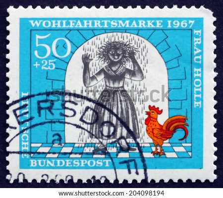 GERMANY - CIRCA 1967: a stamp printed in the Germany shows Girl Covered with Resin, Scene from Mother Hulda, circa 1967