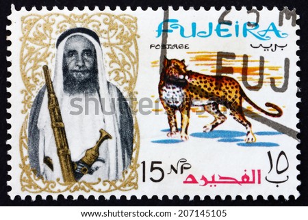 FUJEIRA - CIRCA 1964: a stamp printed in the Fujeira shows Leopard and Sheikh Mohammed Bin Hamad Al Sharqi, circa 1964