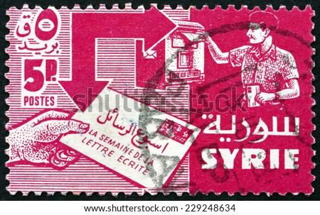 SYRIA - CIRCA 1957 a stamp printed in the Syria shows Mailing and Receiving Letter, International Letter Writing Week, circa 1957