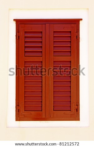 closed brown wooden window shutters, security element