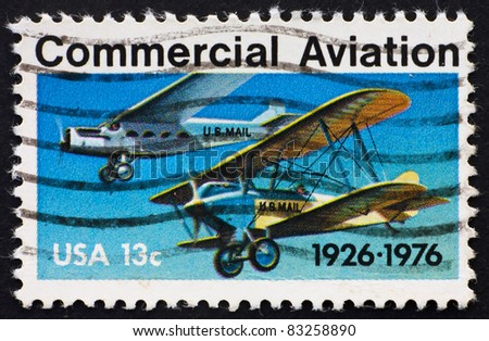 UNITED STATES OF AMERICA - CIRCA 1976: a stamp printed in the USA shows planes, Ford-Pullman Monoplane and Laird Swallow Biplane, 50 anniversary of 1st contract airmail flights, circa 1976