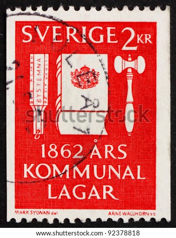 SWEDEN - CIRCA 1962: a stamp printed in the Sweden shows Voting Tool, Codex of Law and Gavel, Centenary of the Municipal Reform Laws, circa 1962