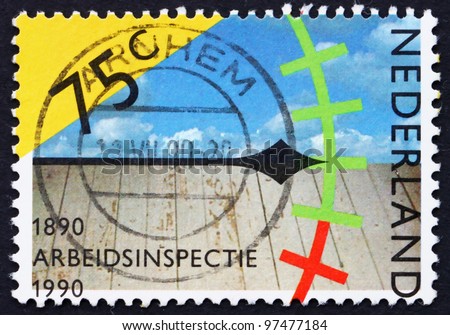 NETHERLANDS - CIRCA 1989: a stamp printed in the Netherlands shows Clock, Sky and Wooden Floor, Assessing Work Conditions, Centenary of Labor Inspectorate, circa 1989