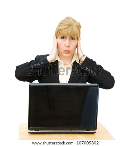 Hear no Evil - no more talking! Businesswoman covering her ears in distress. Isolated over white background.