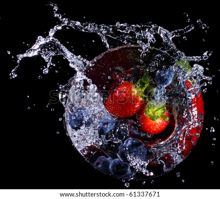 Fruit splashing into a glass. Concept - make a splash