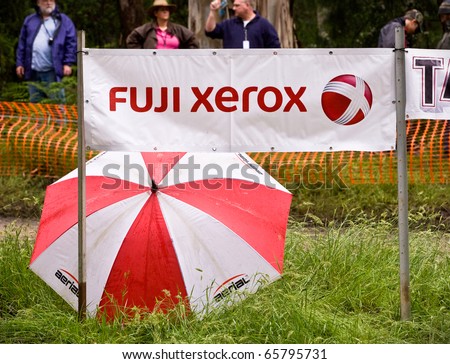 NOOJEE - NOVEMBER 13: Sponsors logo umbrella and safety fence at one of the forest stages of Rally Victoria, November 13 2010, Noojee, Victoria, Australia.
