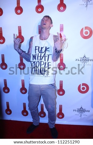 HOLLYWOOD - SEPTEMBER 6, 2012: Rapper Machine Gun Kelly walks the red carpet for Beats By Dr Dre & Lil Wayne VMA After Party at the Playhouse Nightclub September 6, 2012 Hollywood, CA.