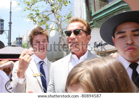 LOS ANGELES - JULY 12: Ex-governor Arnold Schwarzenegger and son Patrick at The Grove for lunch July 12, 2011 Los Angeles, CA.