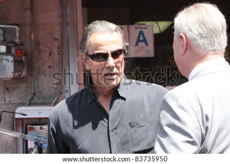 HOLLYWOOD CA - AUGUST 30: Young and Restless star Eric Braeden talking to L.A city official at the Walk of Fame ceremony for Ed O\'Neill August 30, 2011 Hollywood ,CA.