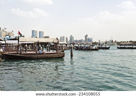 Dubai, UAE - November 29: Traditional Abra (water taxi) crossing the Dubai Creek between Deira and Bur Dubai. November 29, 2014 in Dubai, United Arab Emirates