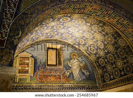 RAVENNA, ITALY -SEPTEMBER 6, 2014: Detail of a Byzantine mosaic depicting St. Lawrence carrying the book of Psalms and a cross in the Mausoleum of Galla Placidia, in Ravenna, Italy.
