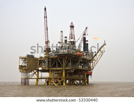 Offshore oil production facility view from the supply boat on a foggy day