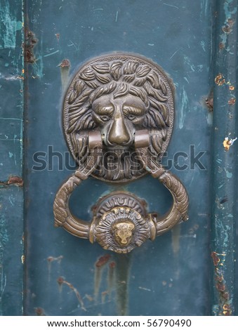 Knocker on an old door in the city of Lisbon