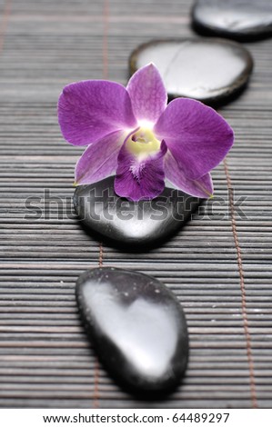orchid and line Stones on bamboo stick straw mat