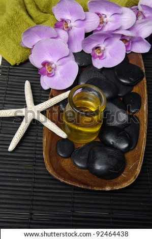 spa concept (zen stones, starfish, towel, Massage oil, orchid,)