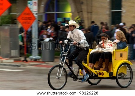 Austin, TX - March 9: SXSW Interactive Conference in Austin.   Austin Pedicabs are in high demand during the conference
