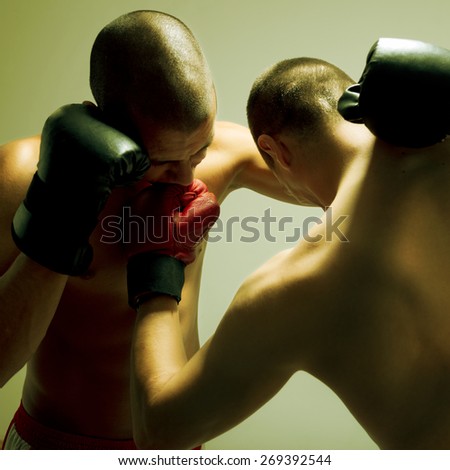 Two men with boxing glove fighting