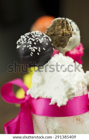 Cake pops, sweet soft food made from a mixture of flour, shortening, eggs, sugar, and other ingredients, baked and often decorated
