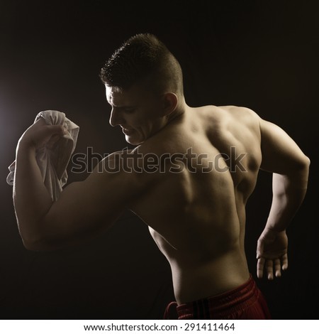 Muscular builder man posing and show his body
